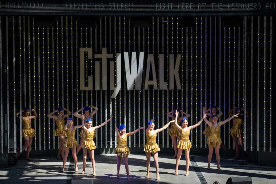 group in yellow performing