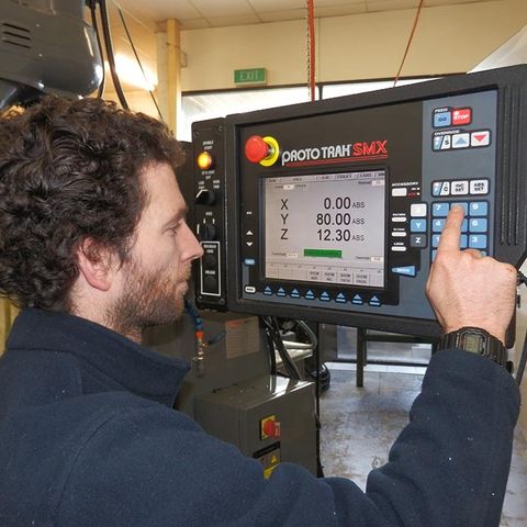 man operating industrial machinery