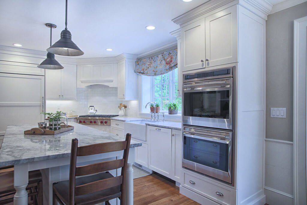warm up a white kitchen with pendant lighting