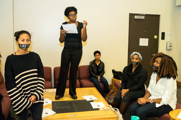 Students at the University of Texas at Austin used a ‘die-in’ to protest the use of blackface in an on campus theatre performance titled ‘Big Minstrel Jubilee,’ Dec. 2015.