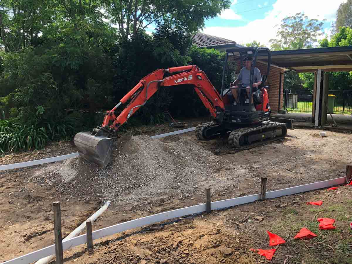 Mini excavator, concreting service — Decorative Concrete on the Central Coast, NSW