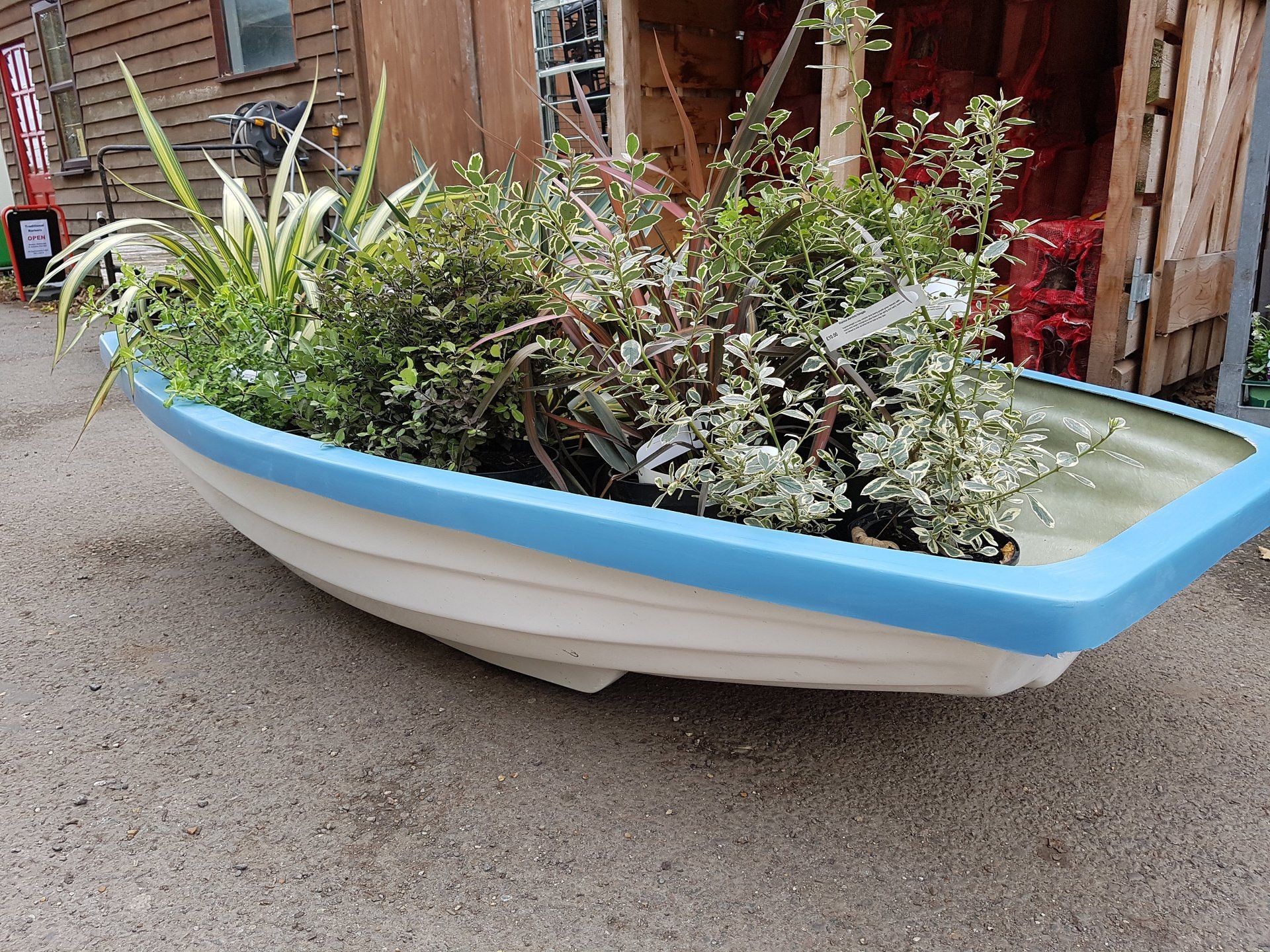 wooden rowing boat garden feature suffolk, uk